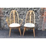 An Ercol vintage gold label, elm seated and beech framed swan back carver chair and matching