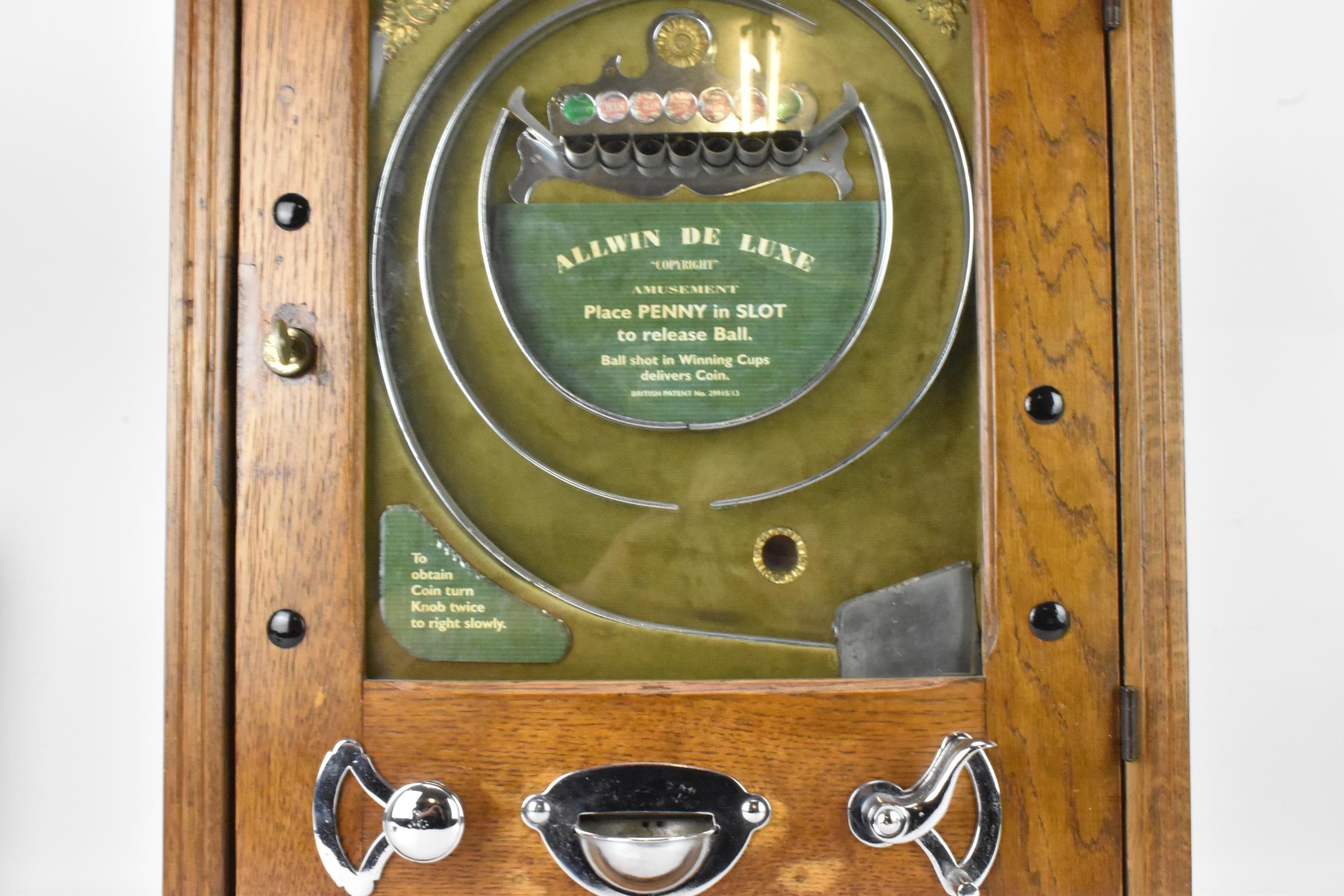 An Allwin De Luxe oak cased penny slot machine, circa 1920, with internal metal ball track, - Image 4 of 12