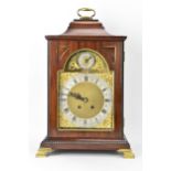 A late 19th/early 20th century mahogany 8 day mantle clock, the case having an inverted bell top