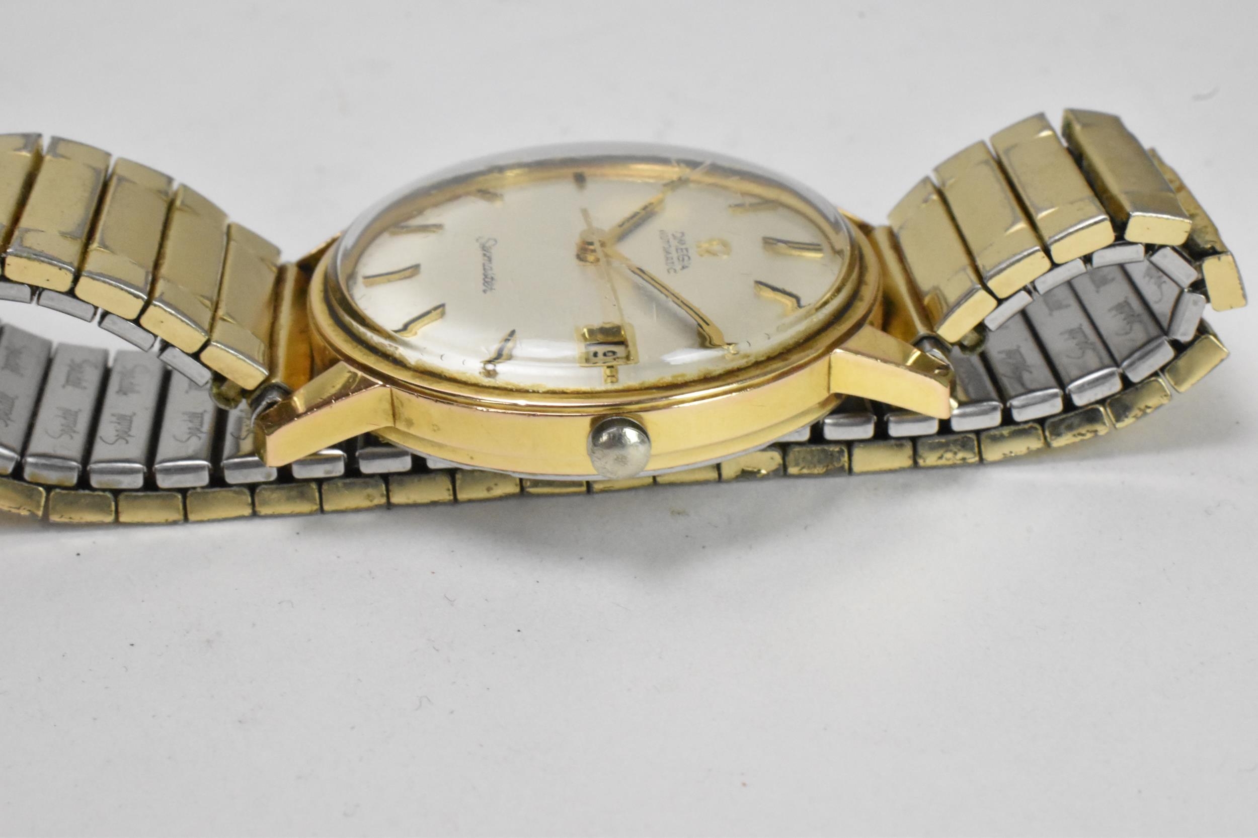 An Omega Seamaster, automatic, gents, gold plated wristwatch, having a silvered dial, centre - Image 3 of 9