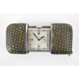 A Movado Chronometre Ermeto Art Deco steel and snake skin travelling purse watch, having a square