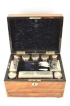 A Victorian rosewood work box, the case inset with mother of pearl, secret drawer to one side and