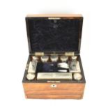 A Victorian rosewood work box, the case inset with mother of pearl, secret drawer to one side and