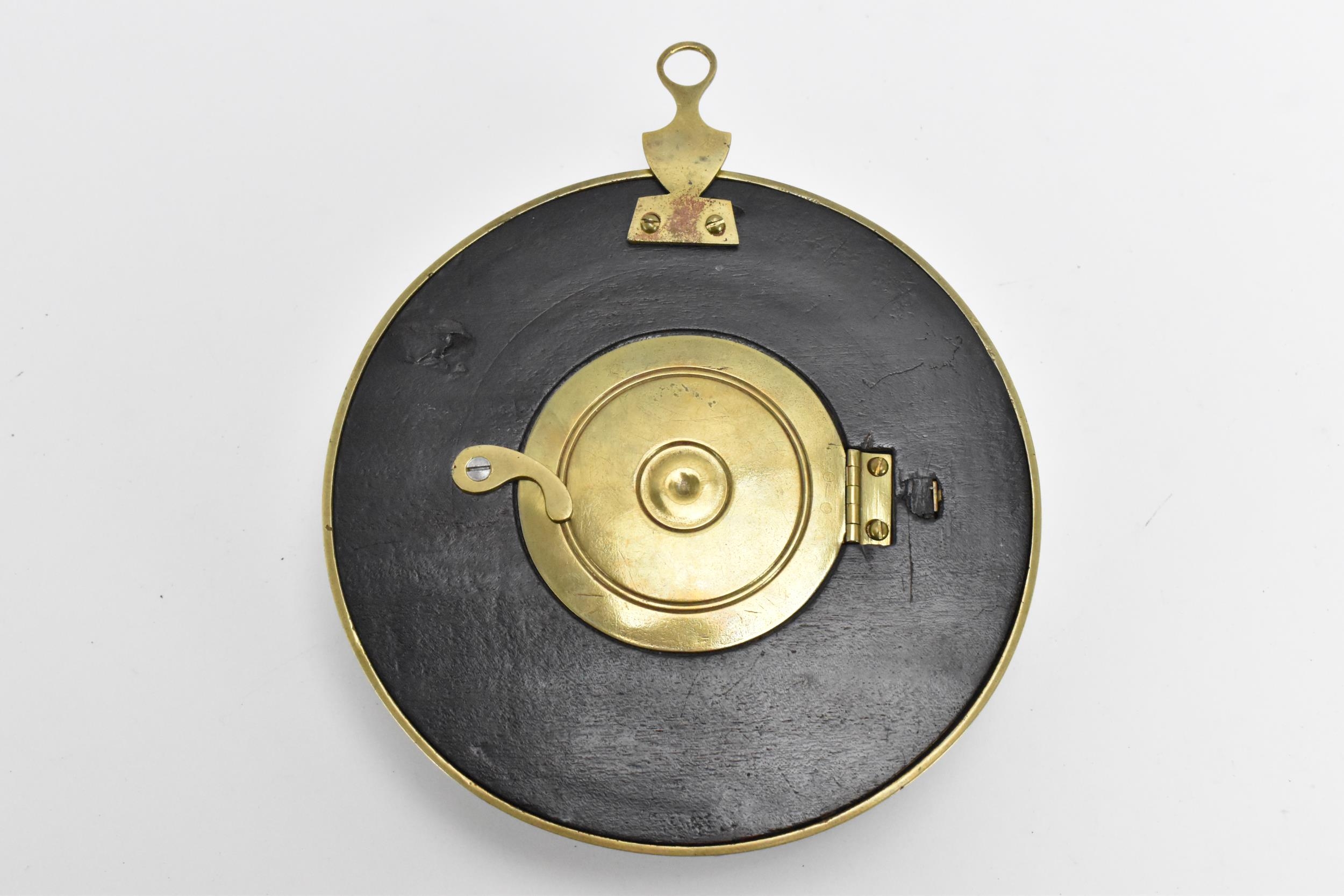 An early 19th century sedan chair clock, having a stepped circular ebonised case with brass - Image 5 of 6