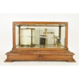 An early 20th century barograph, the oak case with bevelled glass and chart drawer, labelled 'J Beck