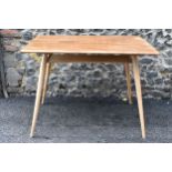 A 1960s Ercol blonde elm and beech breakfast table, model 395, having a rectangular top with a