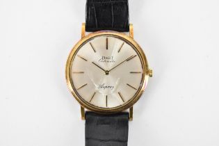 An Piaget ultra-slim, automatic, gents, 18ct gold wristwatch, retailed by Aspreys, having a silvered