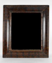 A William and Mary walnut oyster veneered mirror, circa 1690, having a cushion moulded frame, the