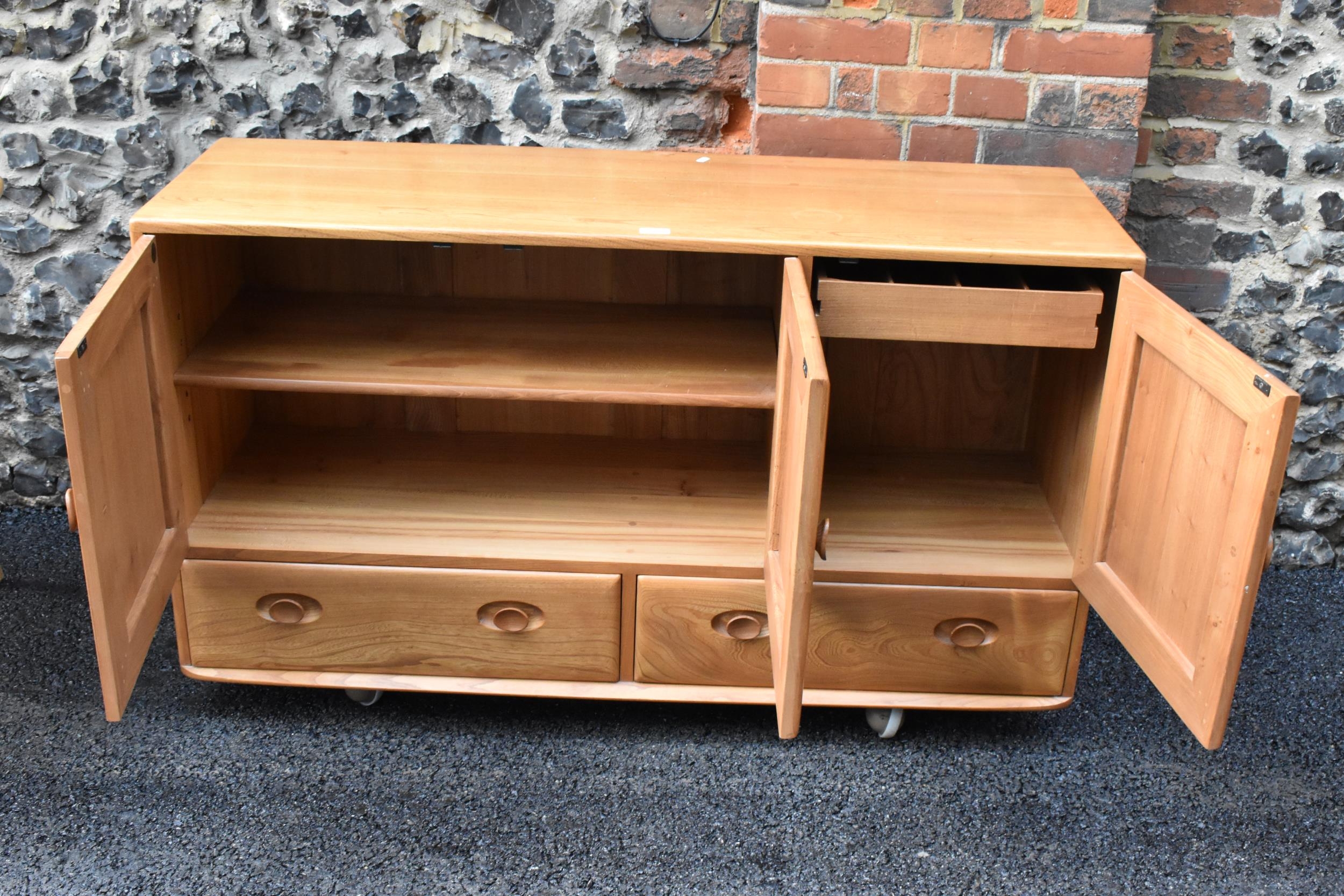 A mid 20th century Ercol Windsor range light elm sideboard, mode 468, having three cupboard doors - Image 6 of 6