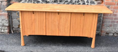 A rare 20th century Ercol Saville elm sideboard The oversized plank top raised over a ridged base