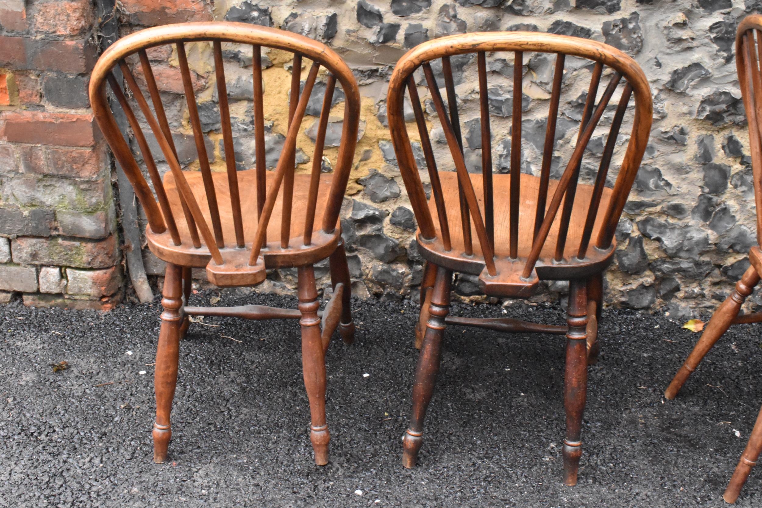 A set of four 19th century elm and ash Windsor dining chairs, having spindle hoop shaped backs, - Image 8 of 10