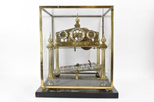 A 20th century Congreve clock, housed in glass display cabinet, having three silvered chapter rings,