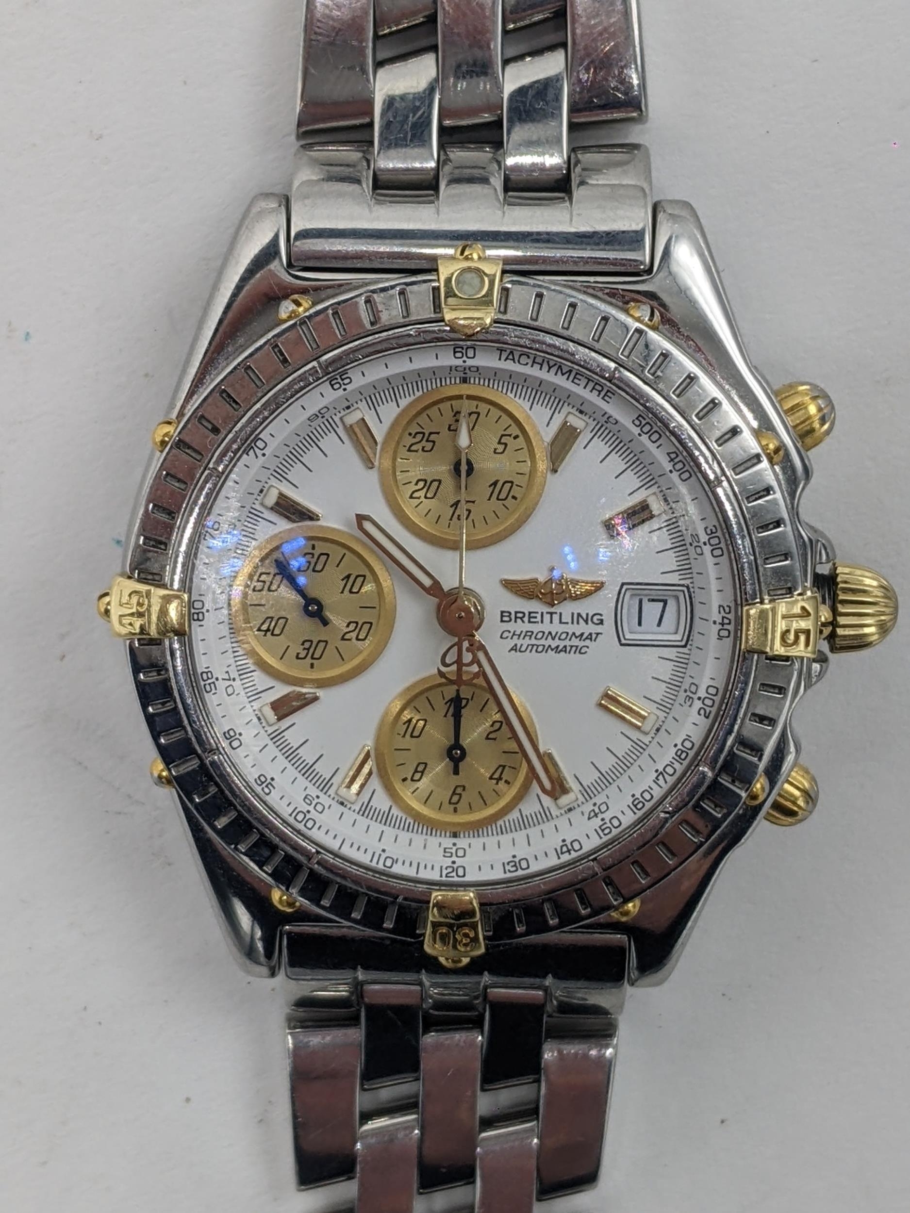 A Breitling Chronomat chronograph gents, automatic, stainless steel wristwatch with gold rider tabs,