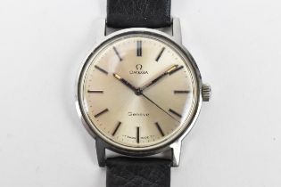 An Omega, manual wind, gents, stainless steel wristwatch, having a silvered dial, centre seconds,