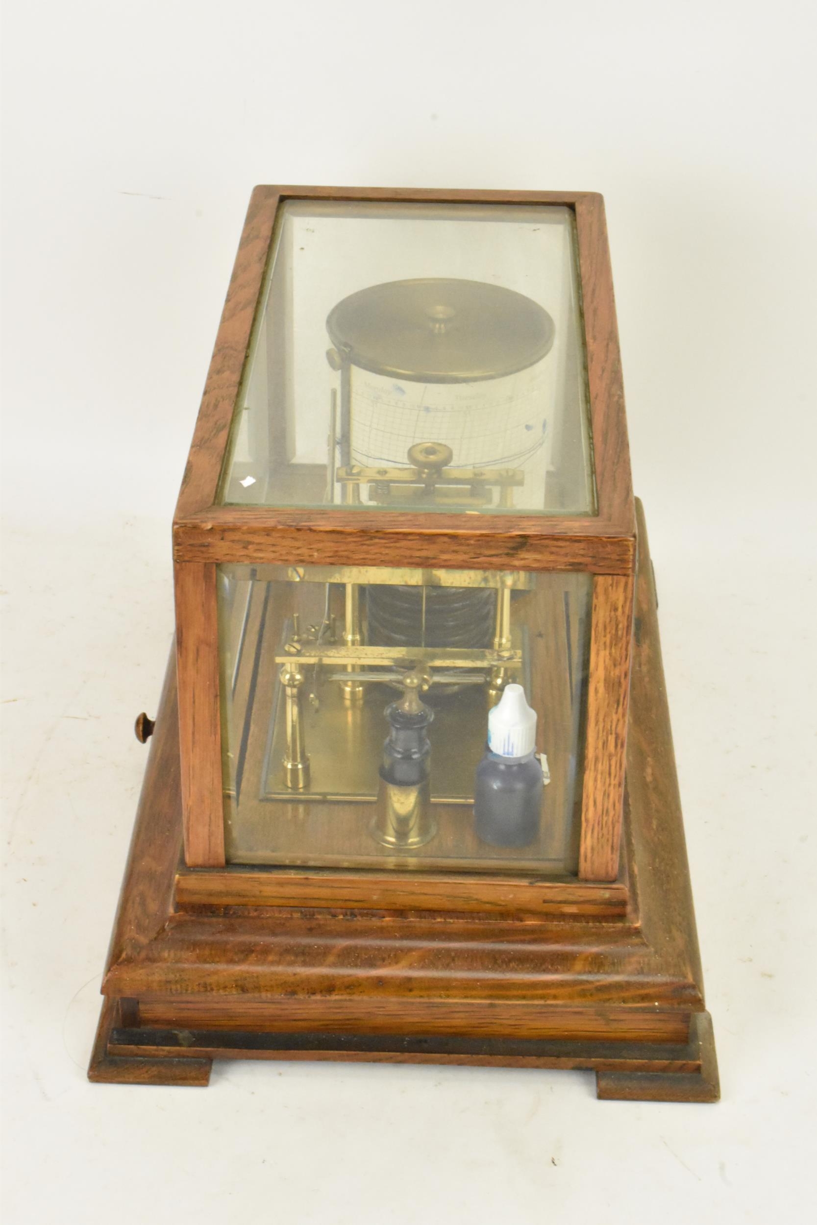 An early 20th century barograph, the oak case with bevelled glass and chart drawer, labelled 'J Beck - Image 6 of 7