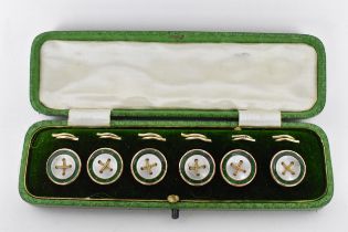 A set of 9ct mounted dress studs with faux mother of pearl and green enamel detail and woven chain