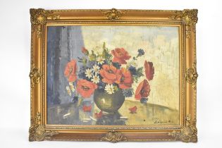 A Hungarian still life oil on canvas depicting flowers in a vase, indictinctly signed to the lower