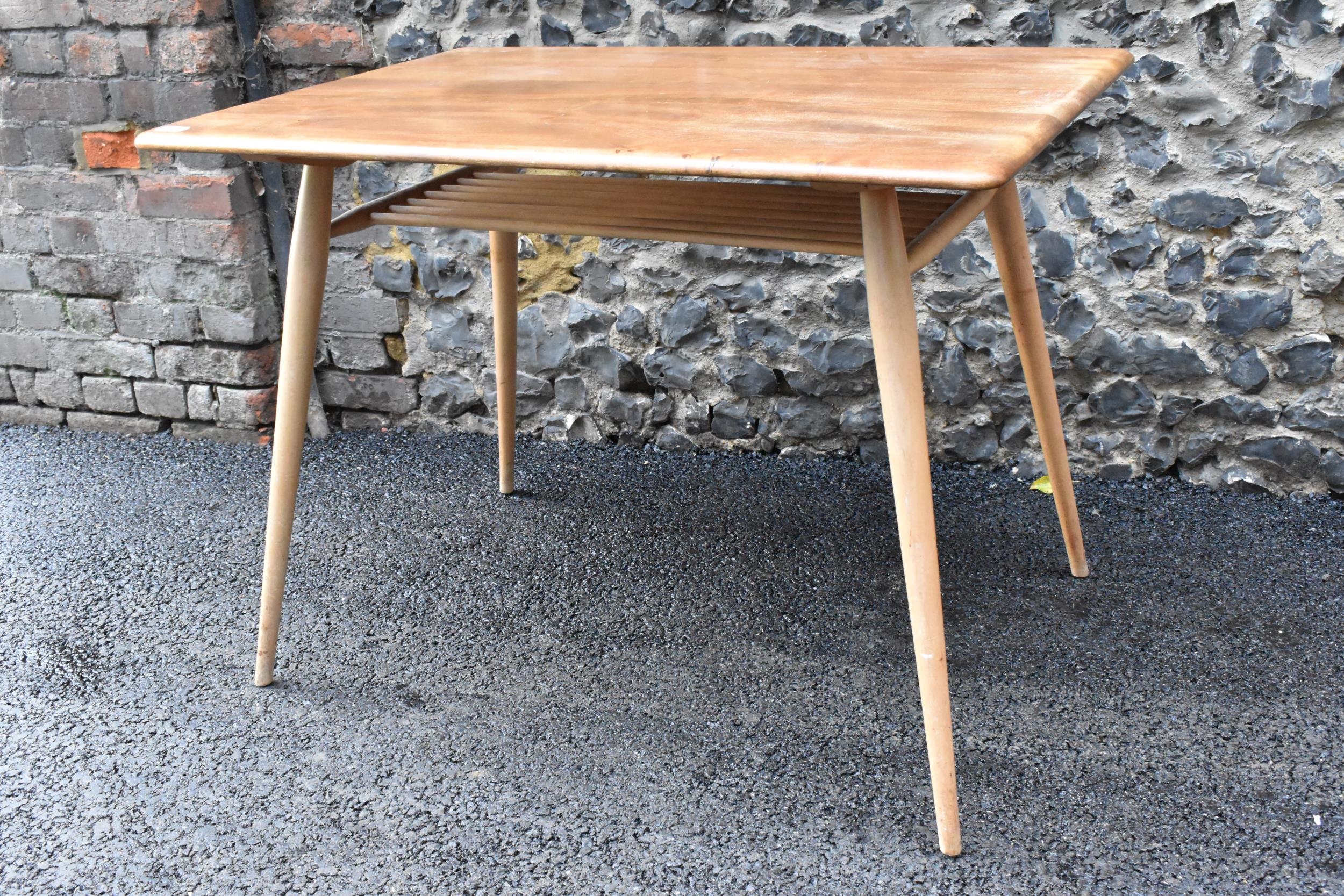 A 1960s Ercol blonde elm and beech breakfast table, model 395, having a rectangular top with a - Image 6 of 6