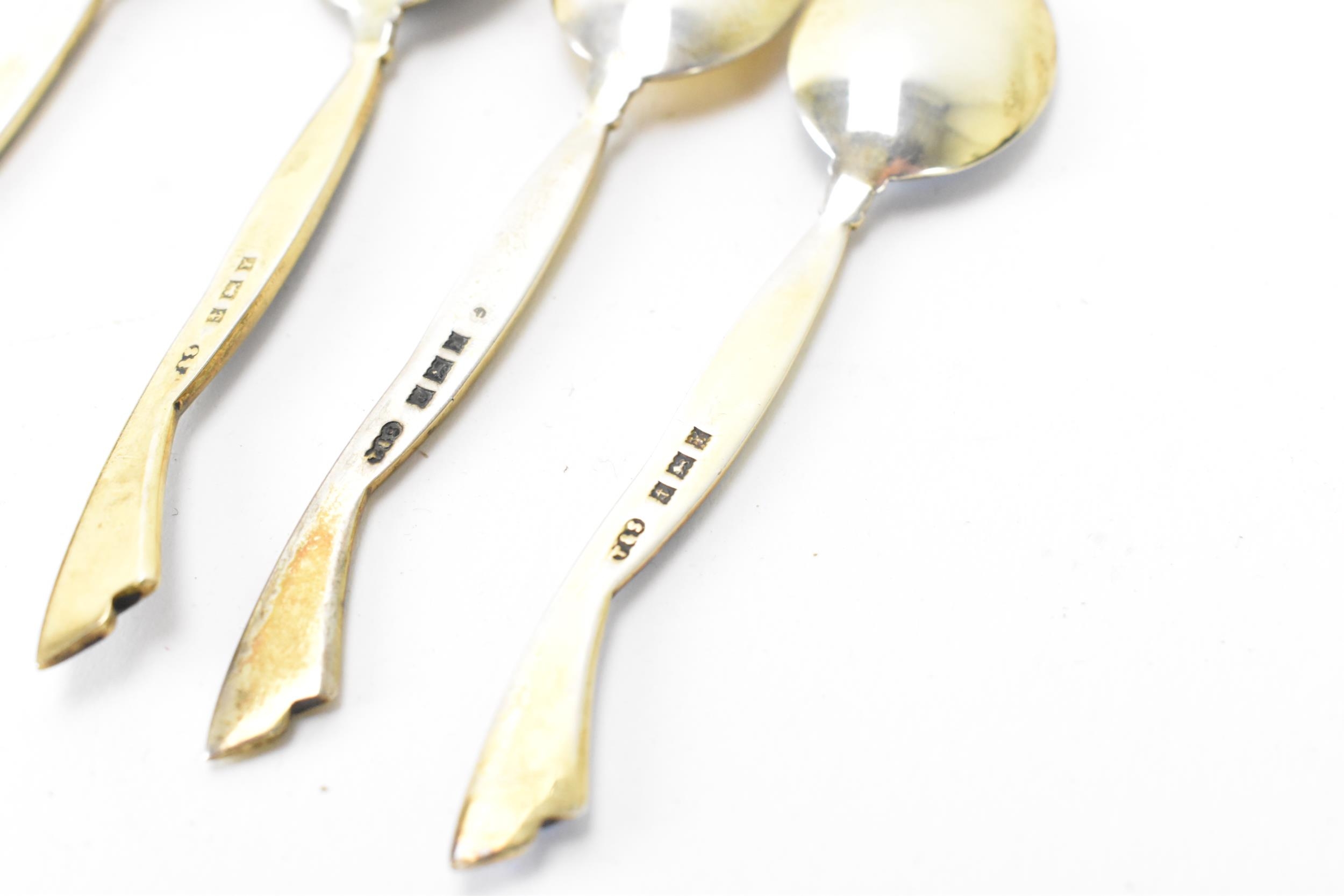 A cased set of six mid 20th century coffee bean spoons, retailed by Harrods, all having guilloche - Image 5 of 6