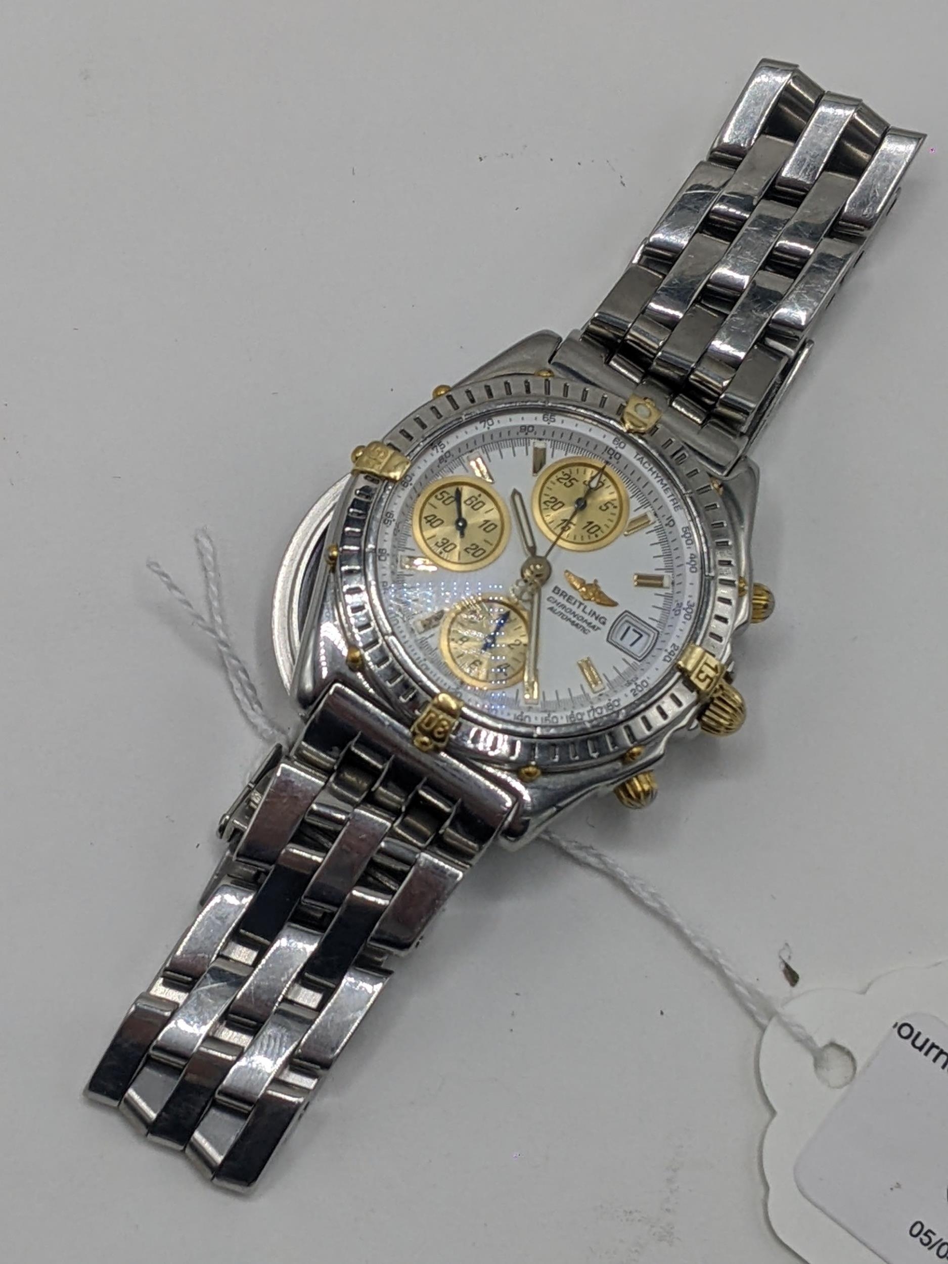 A Breitling Chronomat chronograph gents, automatic, stainless steel wristwatch with gold rider tabs, - Image 8 of 8
