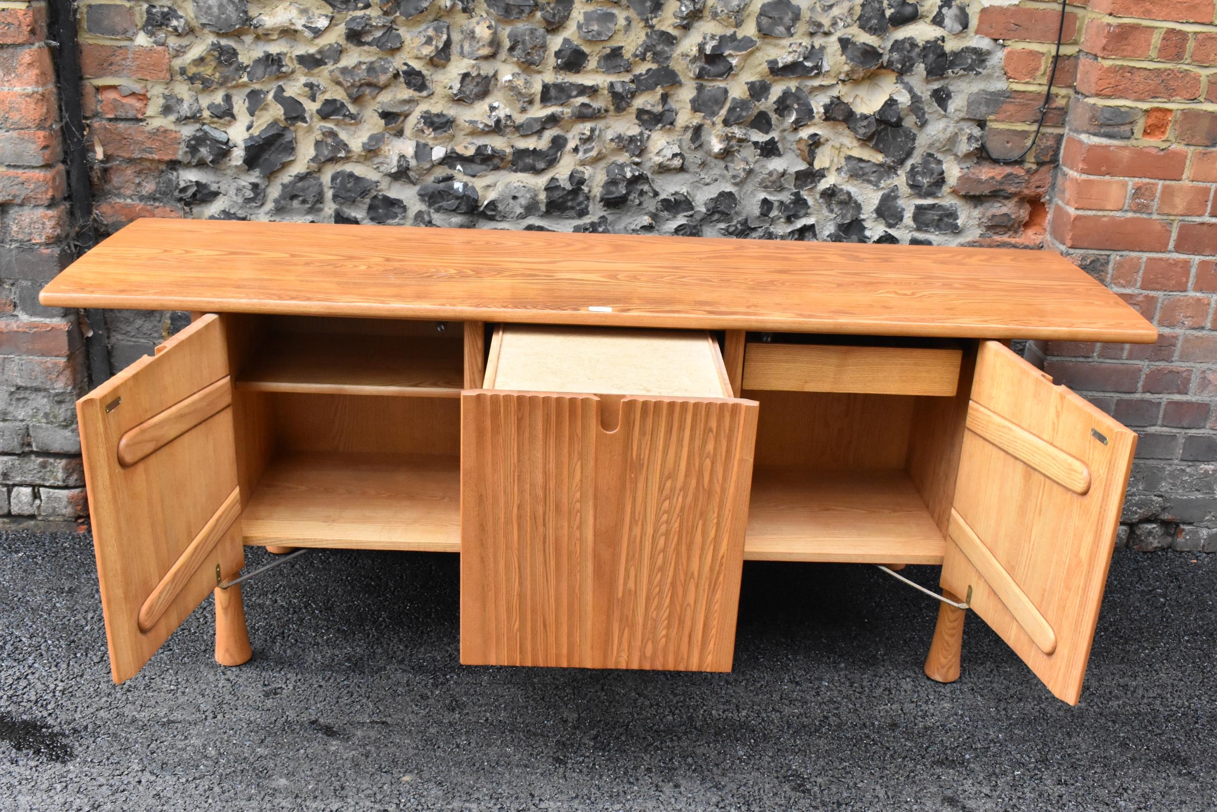 A rare 20th century Ercol Saville elm sideboard The oversized plank top raised over a ridged base - Image 5 of 6