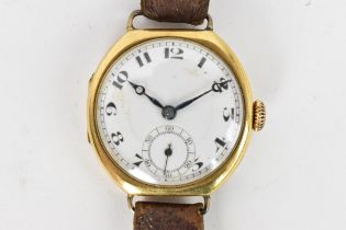 A 1920s, manual wind, gents, 18ct gold wristwatch, having a white enamel dial, subsidiary seconds