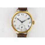 A 1920s, manual wind, gents, 18ct gold wristwatch, having a white enamel dial, subsidiary seconds