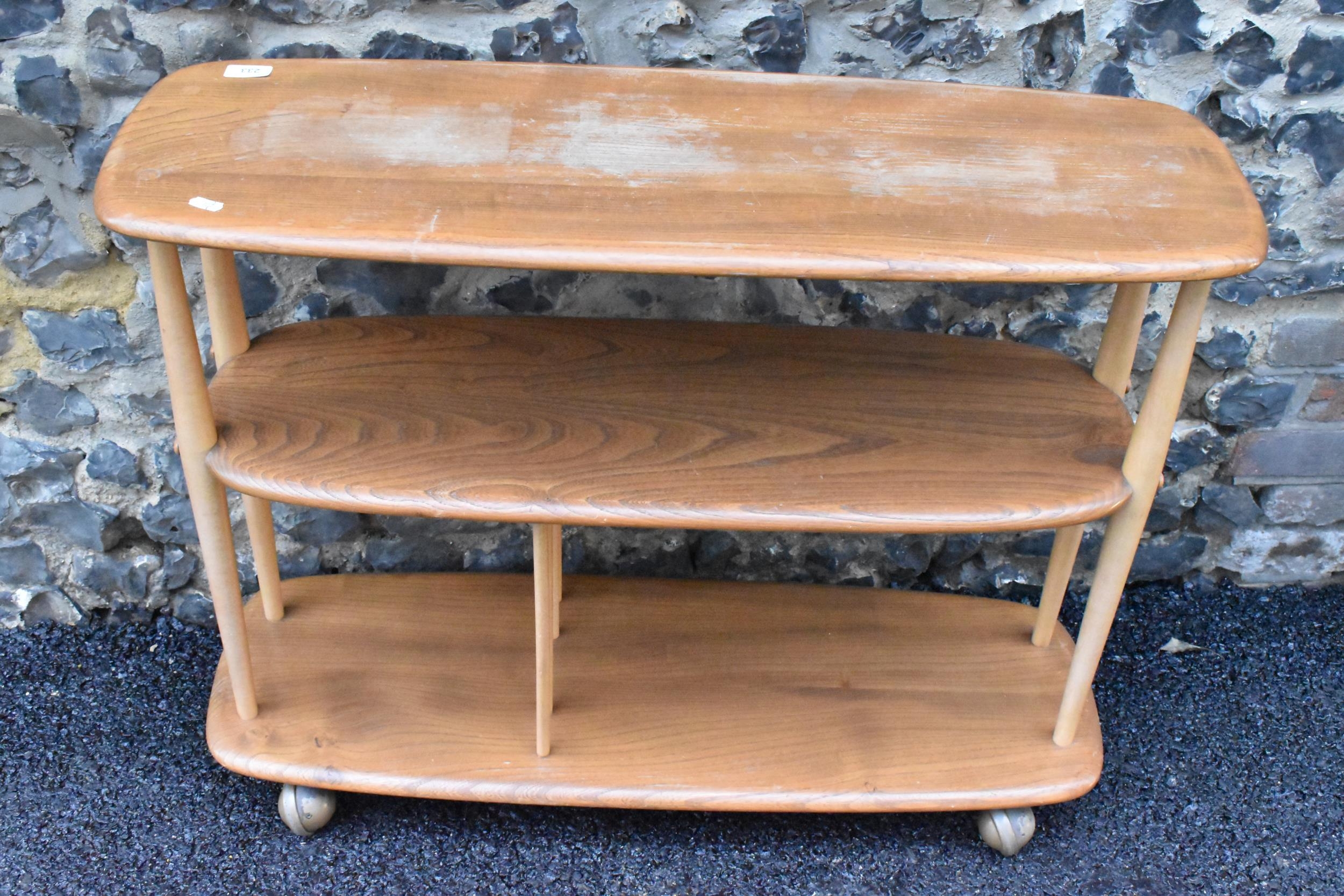 A mid 20th century Ercol elm and beech Baby Giraffe three tier trolley, model 361, Windsor range, - Image 5 of 5