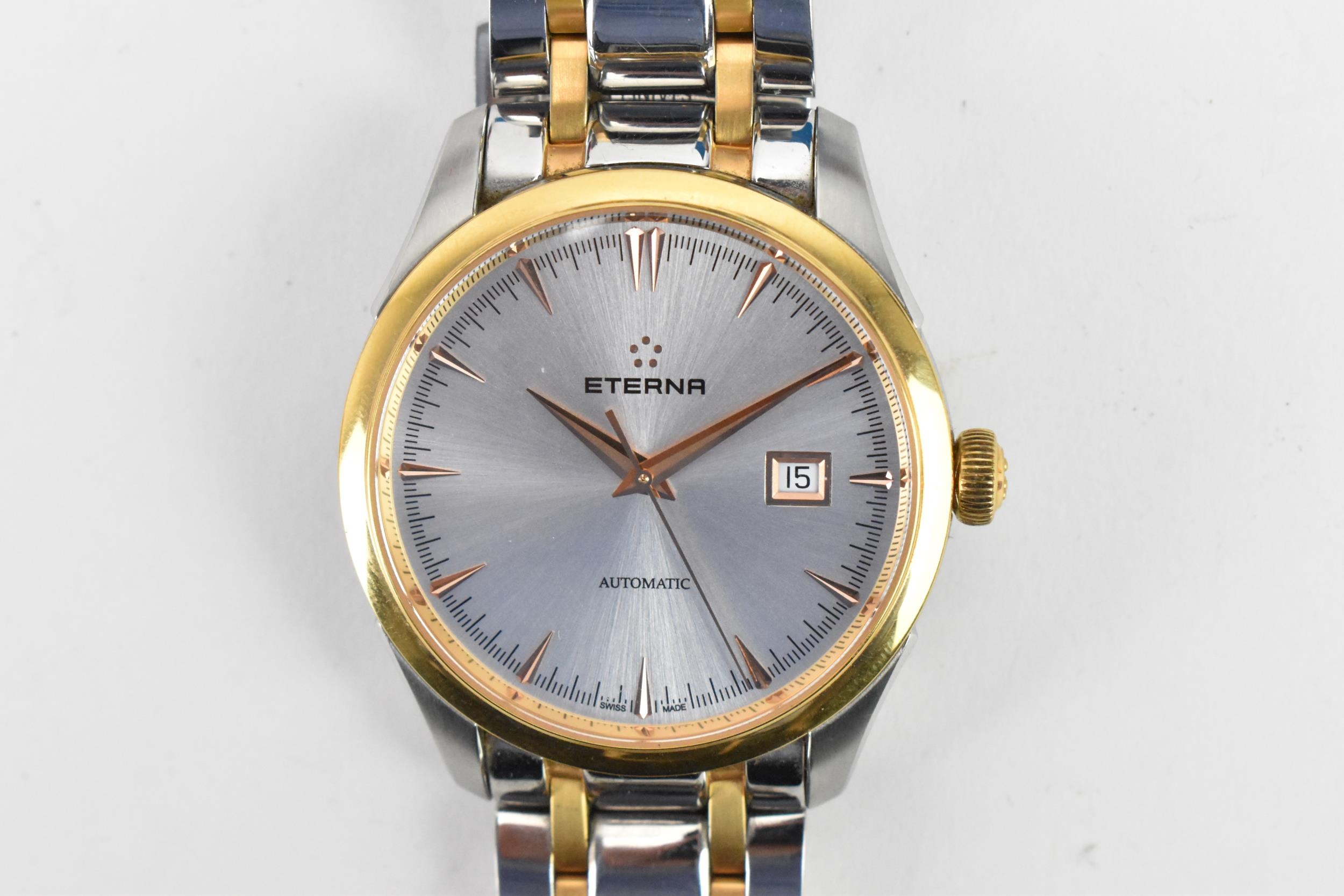 An Eterna, automatic, gents, stainless steel, bi-coloured wristwatch, having a silvered dial, centre