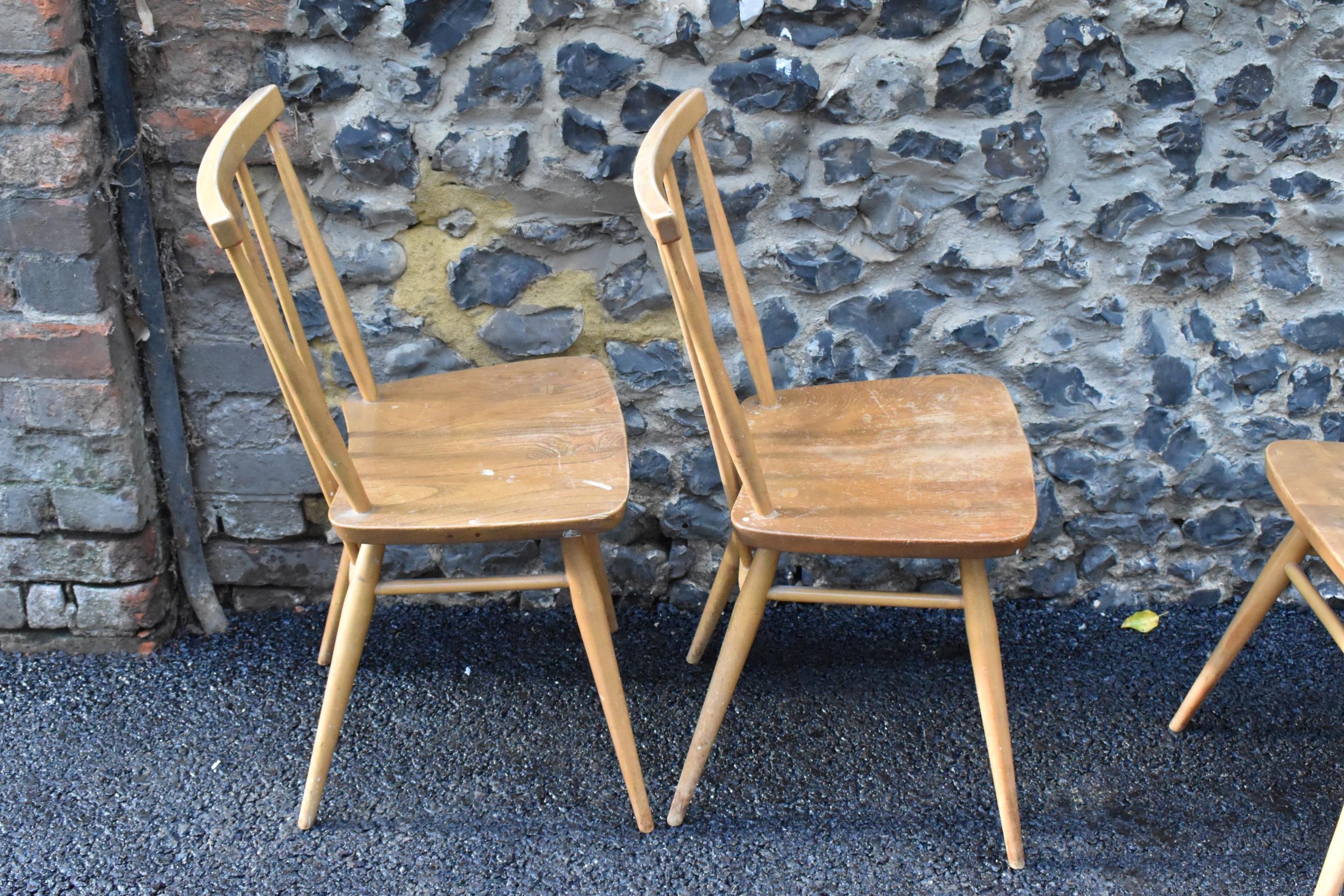 A set of four Ercol blonde elm and beech kitchen dining chairs, model 391, having spindle stick back - Image 9 of 9