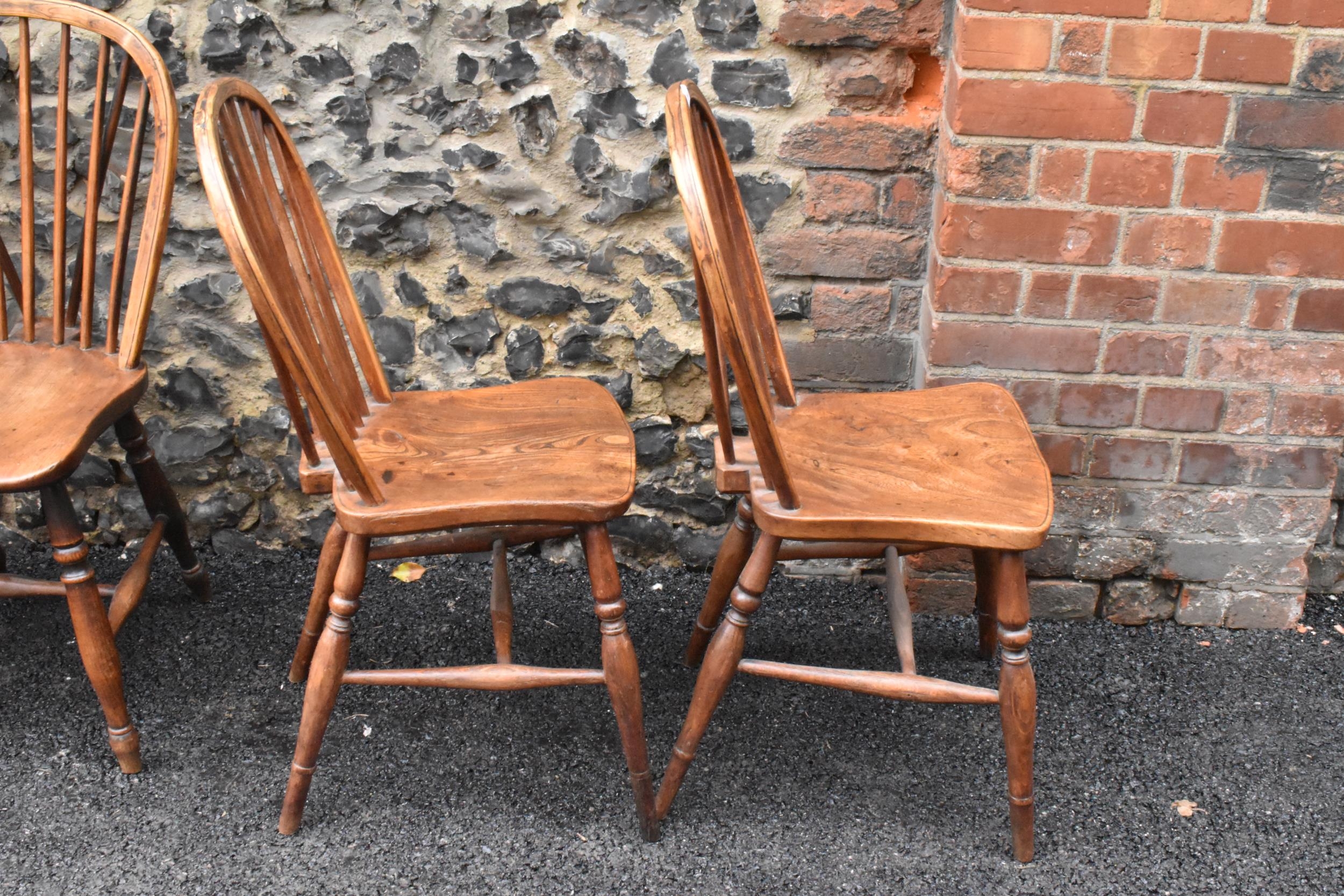 A set of four 19th century elm and ash Windsor dining chairs, having spindle hoop shaped backs, - Image 5 of 10
