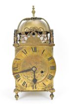 A circa 1900 Mappin & Webb lantern clock, in the 17th century style, the brass case having a