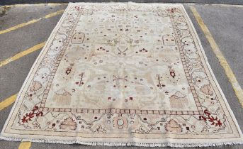 A hand woven English design Zieglar Mahal rug, on a beige ground with repeating floral motifs,