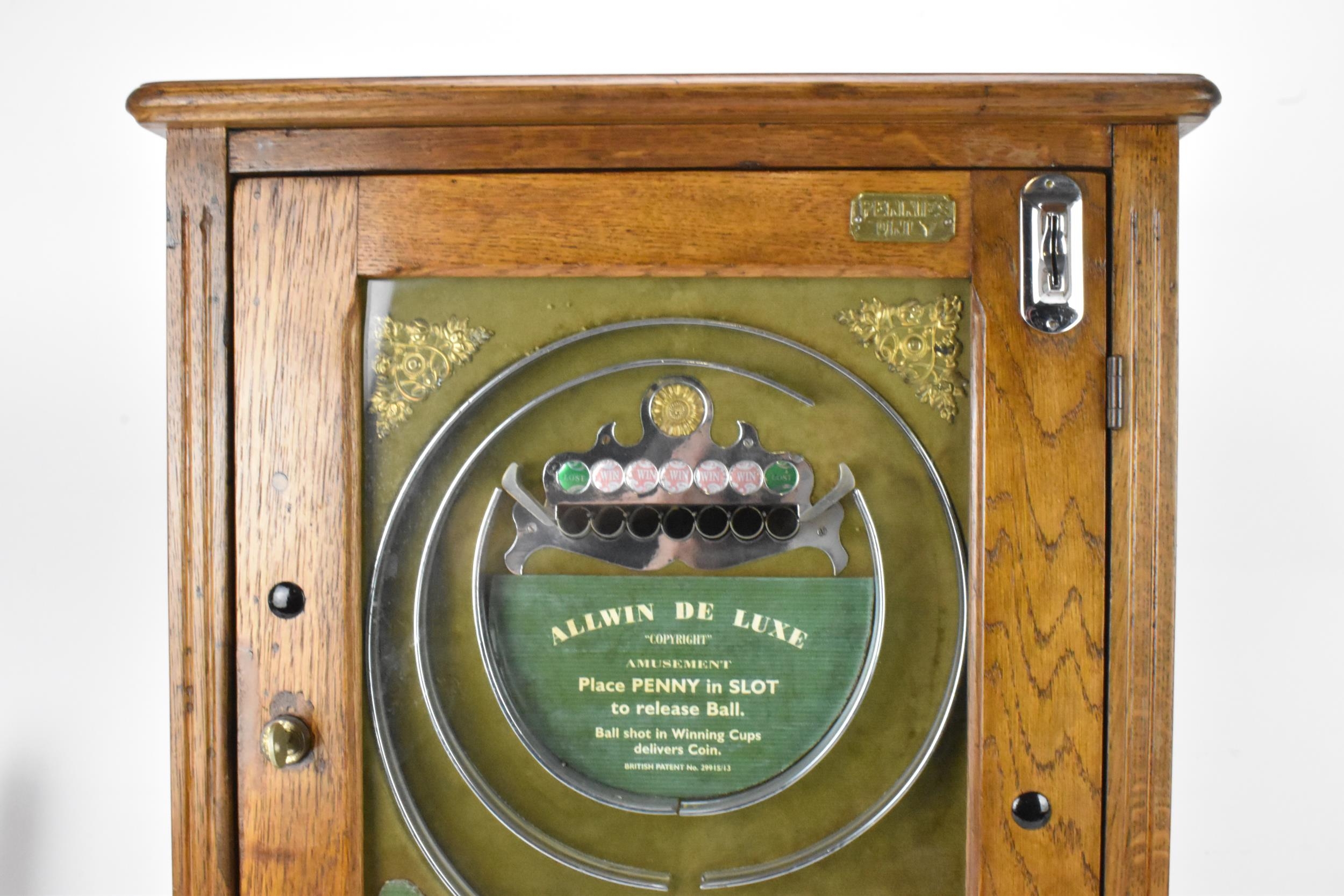 An Allwin De Luxe oak cased penny slot machine, circa 1920, with internal metal ball track, - Image 3 of 12