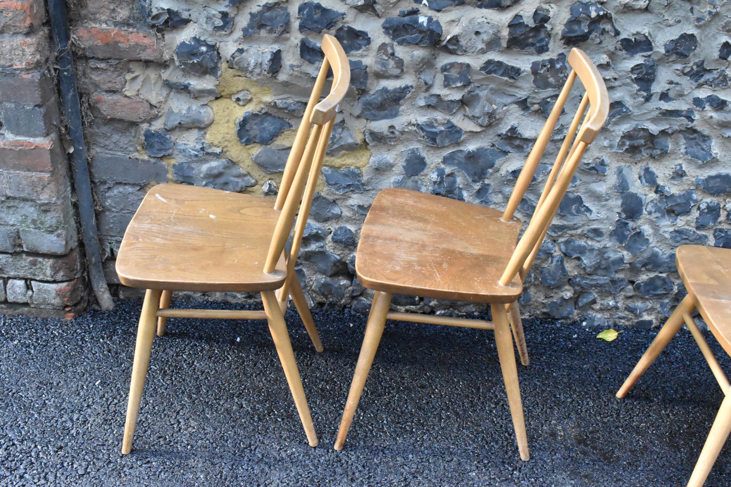 A set of four Ercol blonde elm and beech kitchen dining chairs, model 391, having spindle stick back - Image 7 of 9