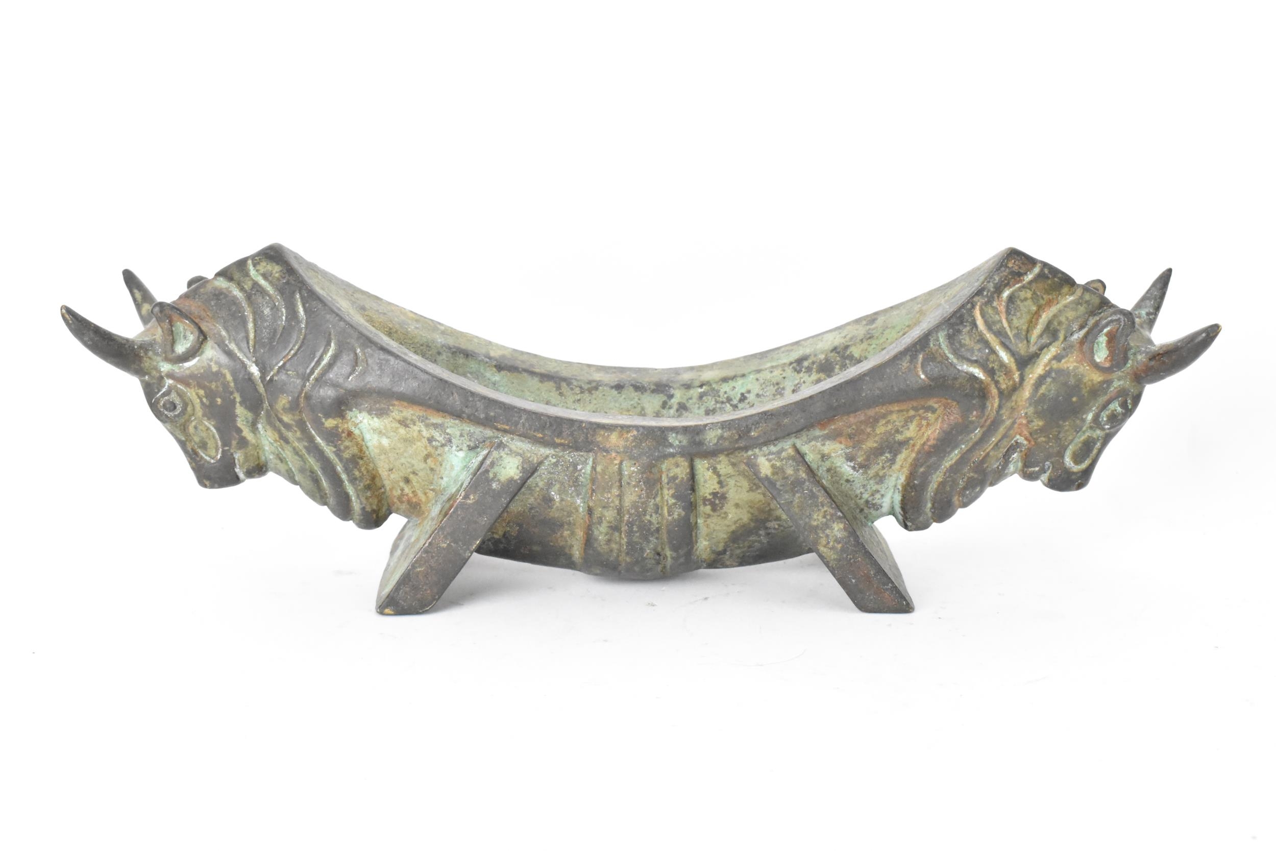 A 20th century Chinese patinated bronzed oblong shaped bowl, the sides fashioned as two bulls - Image 2 of 4