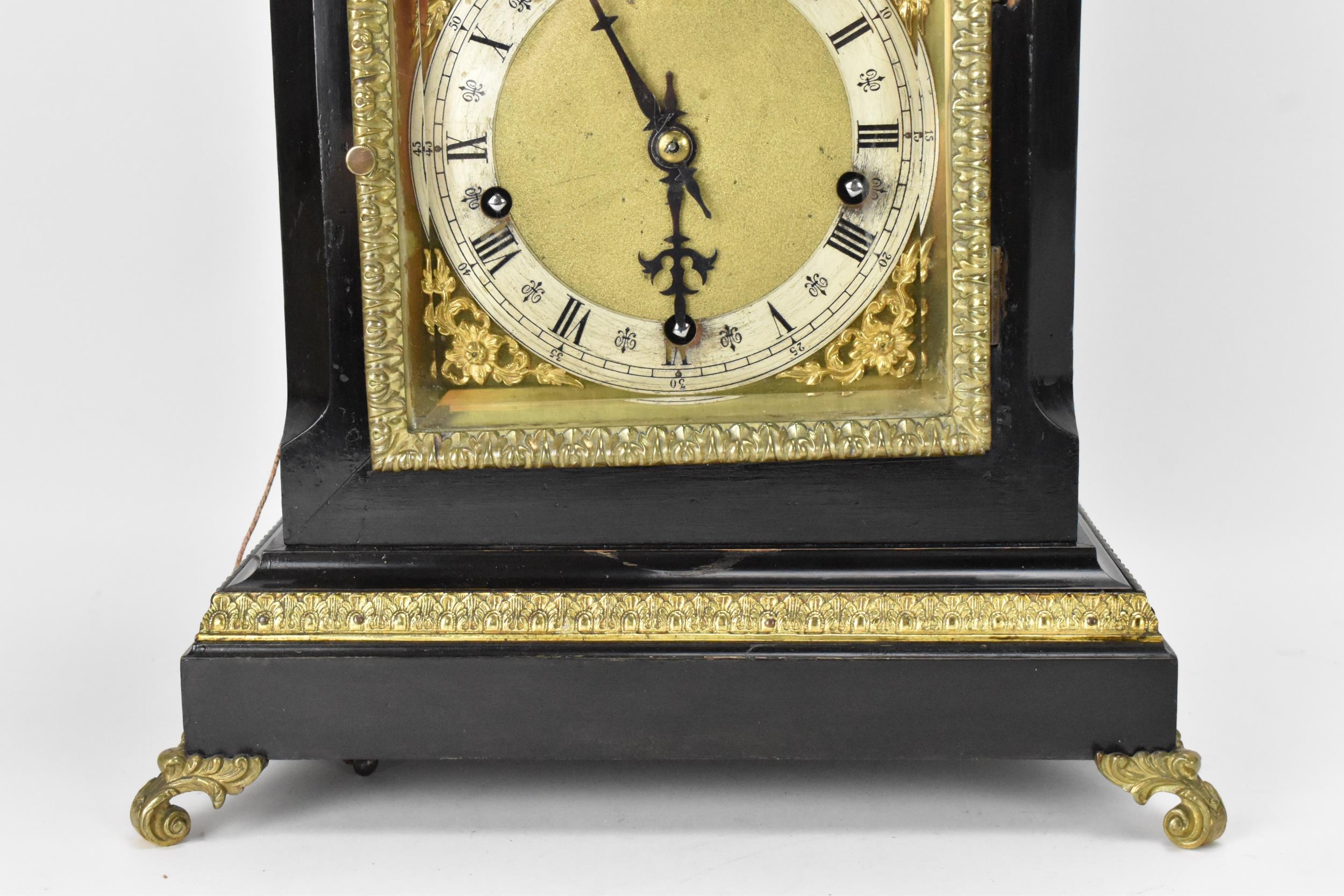 A late 19th century Winterhalder & Hofmeier ebonised mantle clock, the arched top case having cast - Image 3 of 7