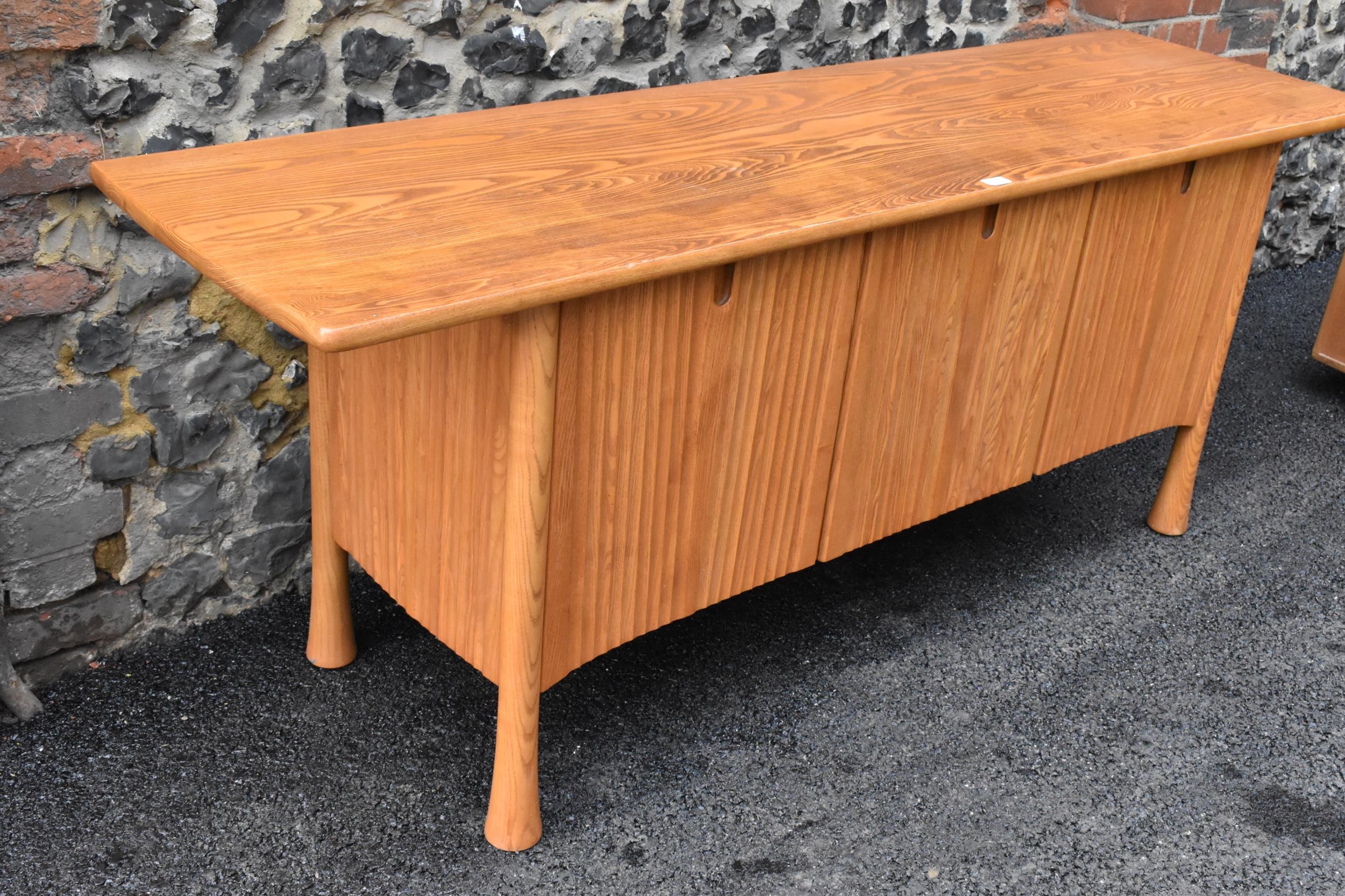 A rare 20th century Ercol Saville elm sideboard The oversized plank top raised over a ridged base - Image 2 of 6