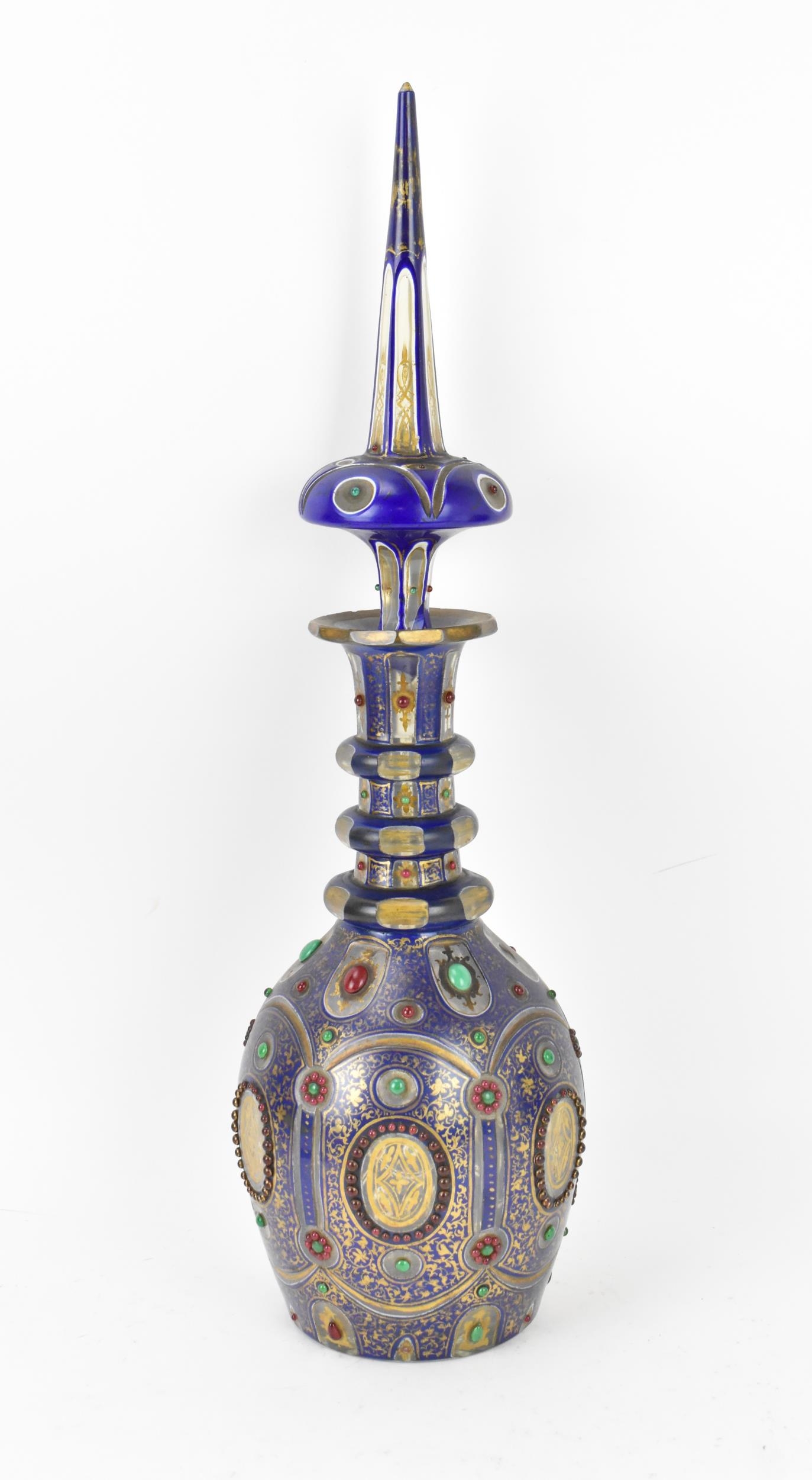 A large 19th century bohemian flash overlay and jewelled cut glass decanter, in cobalt blue