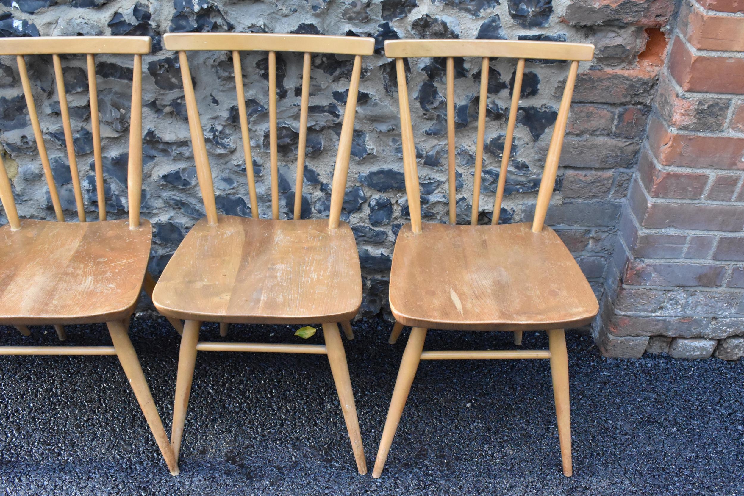 A set of four Ercol blonde elm and beech kitchen dining chairs, model 391, having spindle stick back - Image 2 of 9