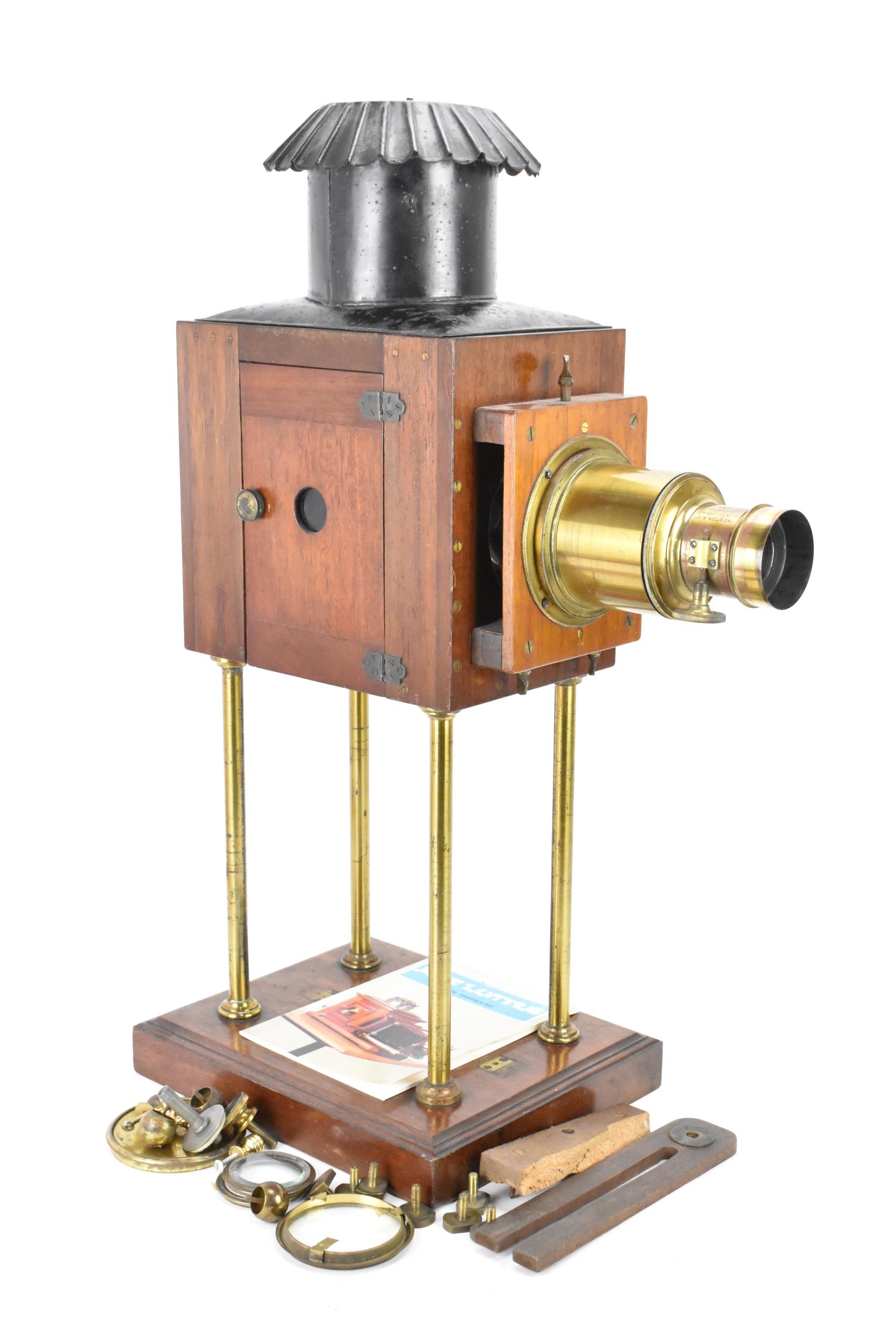 An early 20th century mahogany, brass and lacquered tin Magic Lantern by Newton & Co. 3 Fleet