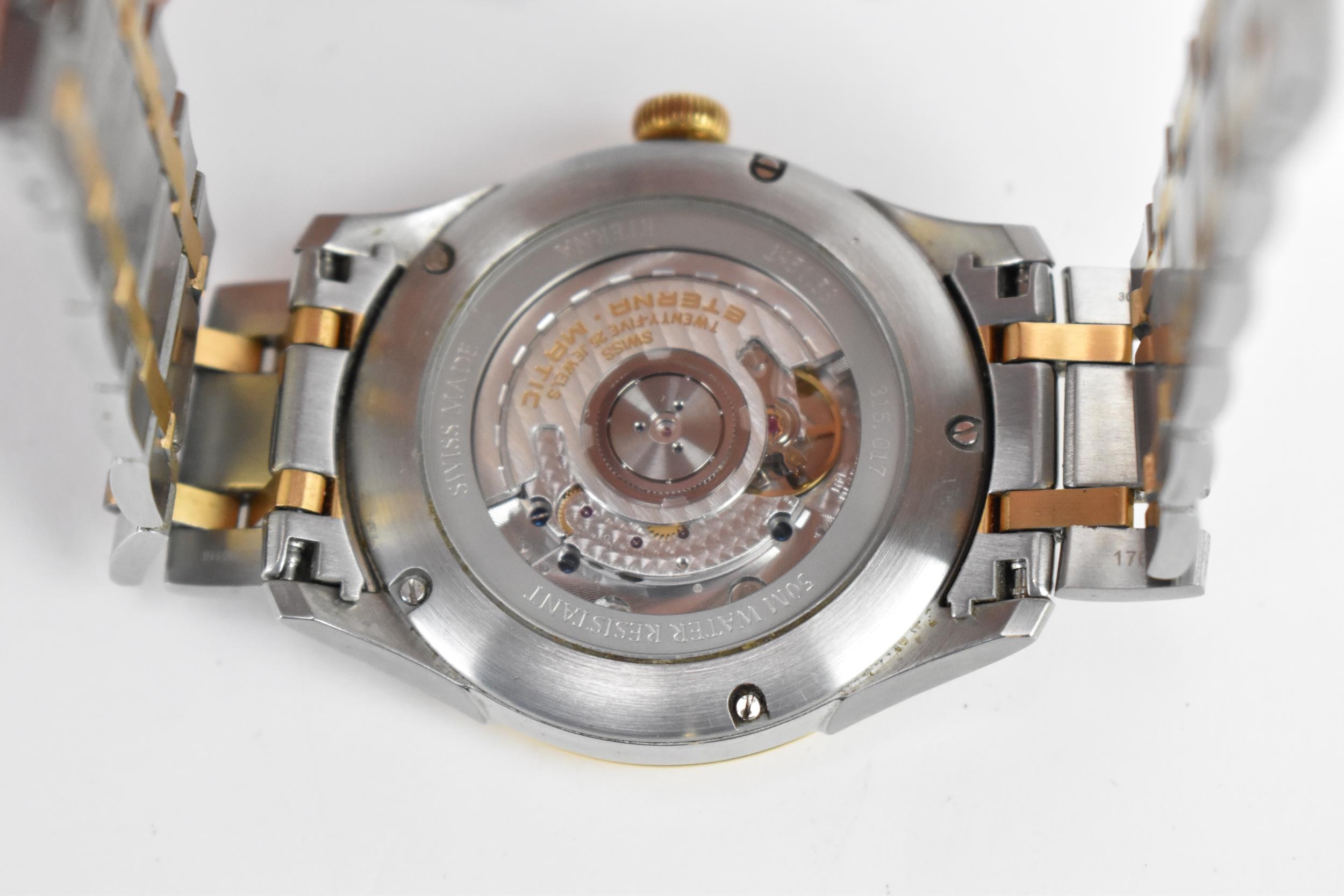 An Eterna, automatic, gents, stainless steel, bi-coloured wristwatch, having a silvered dial, centre - Image 6 of 6