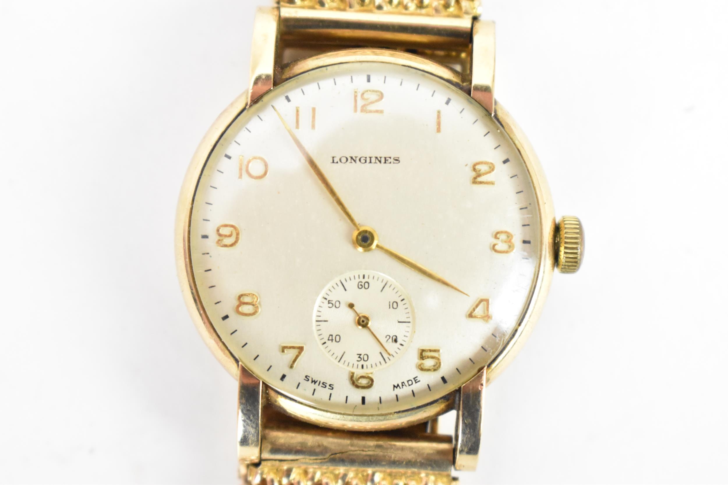 A Longines, manual wind, gents, 9ct gold wristwatch, circa 1950s, having a silvered dial, subsidiary