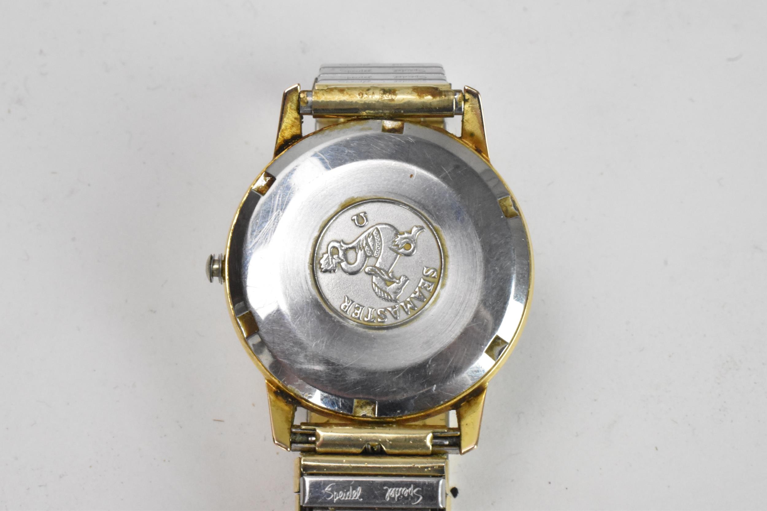 An Omega Seamaster, automatic, gents, gold plated wristwatch, having a silvered dial, centre - Image 5 of 9