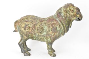 A Chinese patinated bronzed Zodiac model of a ram, relief decorated with snakes, dragons and