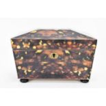 A late 20th century printed tortoiseshell pattern, twin compartment tea caddy, of sarcophagus form