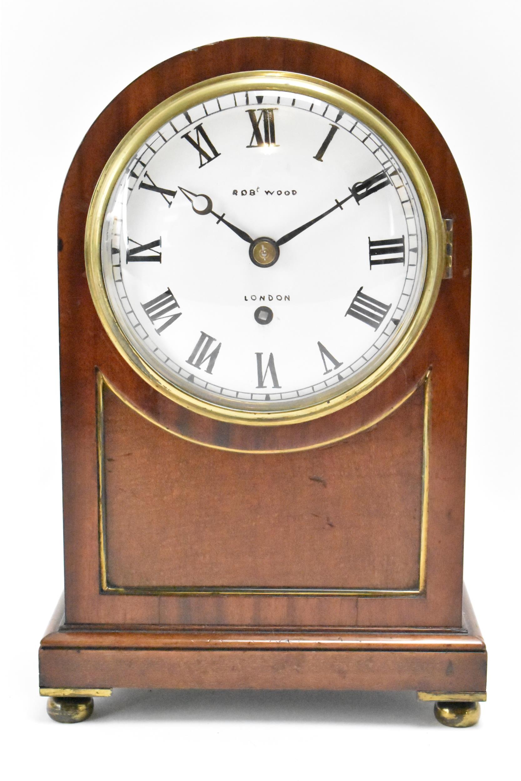 A 19th century mahogany bracket clock, the case having an arched top with gilt pierced side
