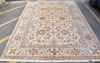 A hand woven English design Zieglar Mahal rug, on a beige ground with repeating floral motifs,