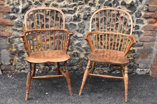 A pair of 19th century elm and ash Windsor carver dining chairs, having spindle hoop shaped backs,