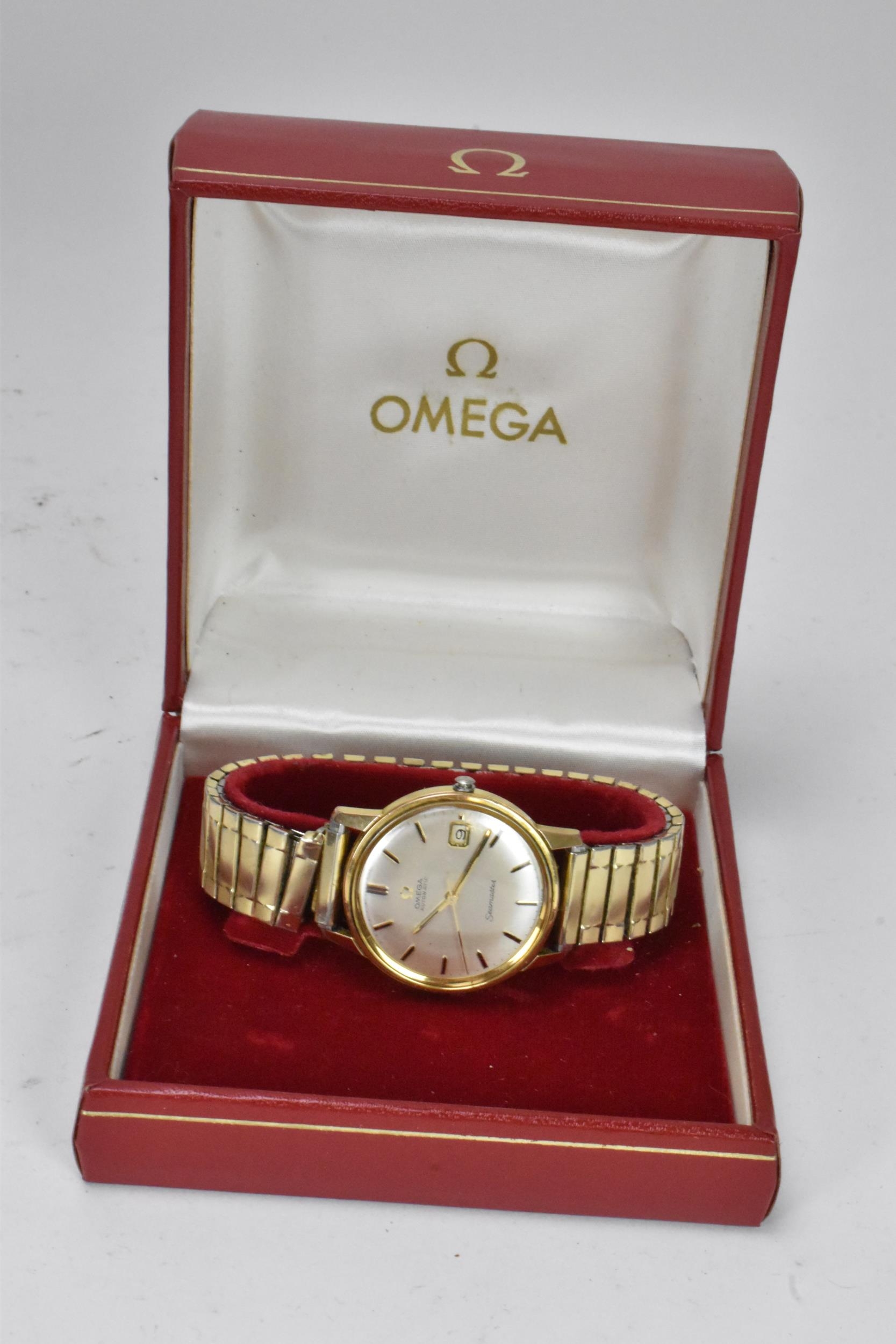 An Omega Seamaster, automatic, gents, gold plated wristwatch, having a silvered dial, centre - Image 9 of 9